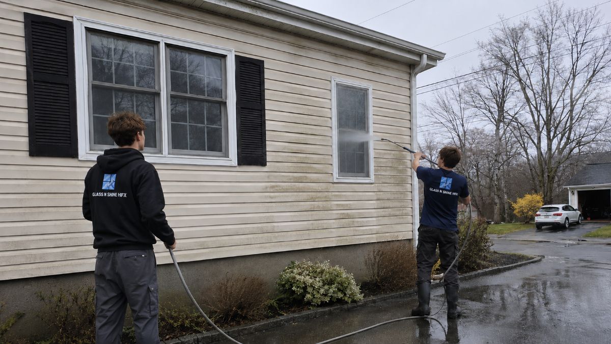 Glass N Shine crew pressure washing a home's siding in Halifax